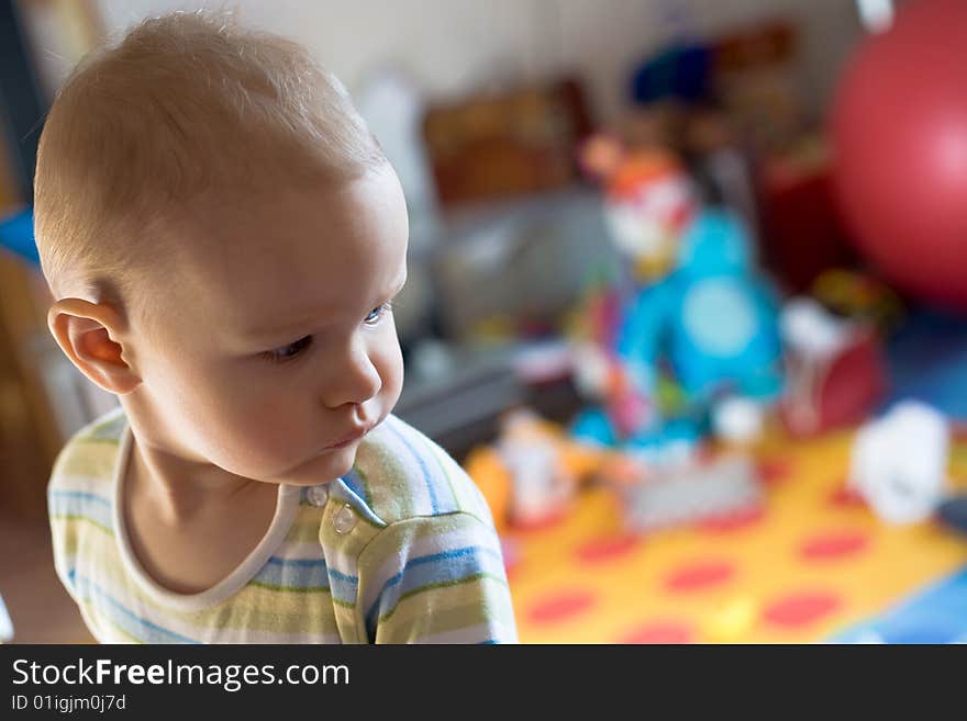 Little baby looks around (Colour blurred background)