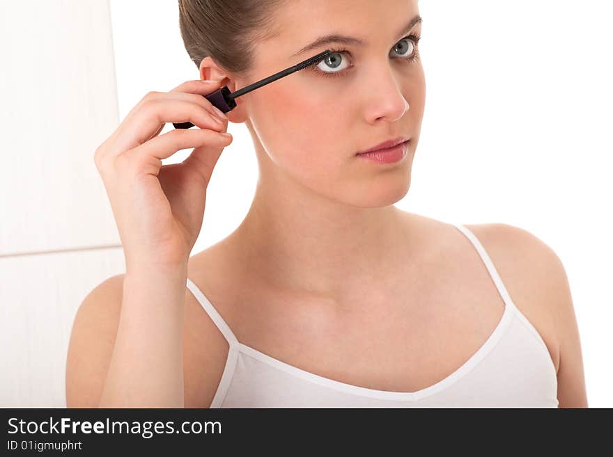 Body care - Young woman apply mascara