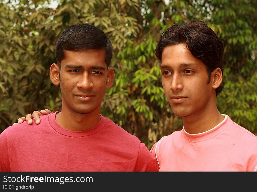 A young man giving a support and assurance to his friend. A young man giving a support and assurance to his friend.