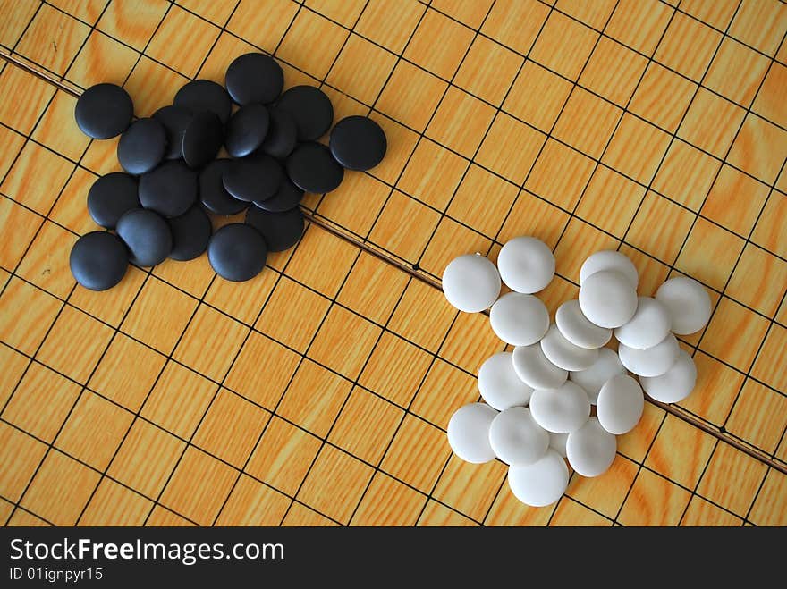 Chinese Go board with black and white pieces