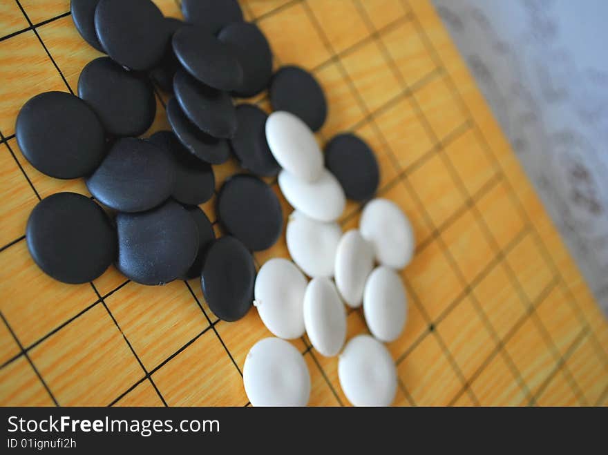 Chinese Go board with black and white pieces