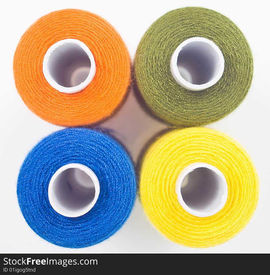 Four sewing spools