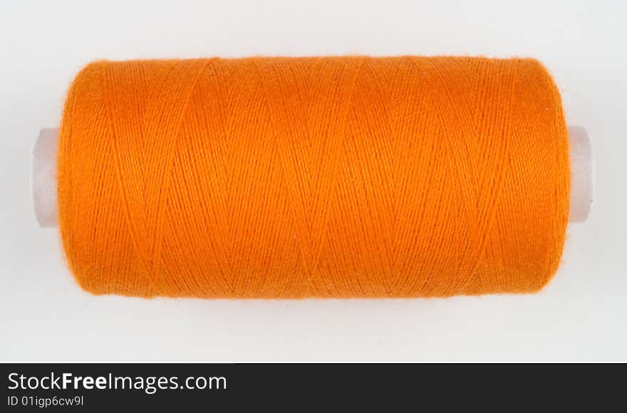 Orange sewing spool