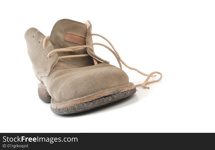 Old worn boot isolated on white background