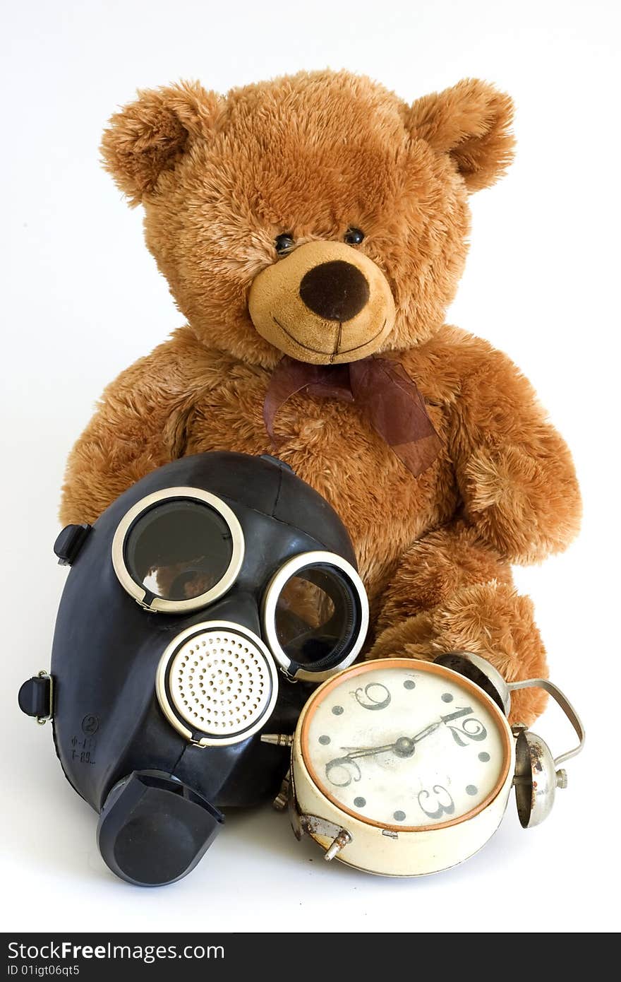 The Nursery toy, gas mask, old watch on white background. The Nursery toy, gas mask, old watch on white background.