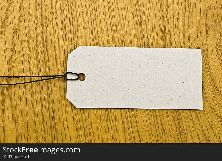 Blank tag on wooden background