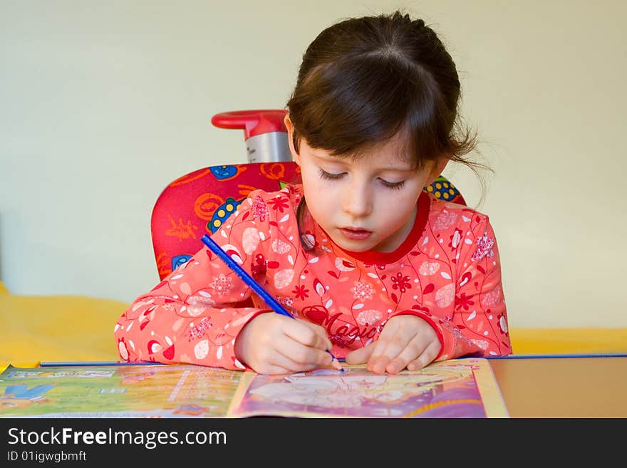 Cute 5 years old girl drawing