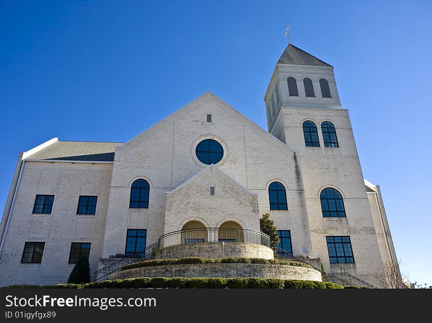 White Brick Church On Blue