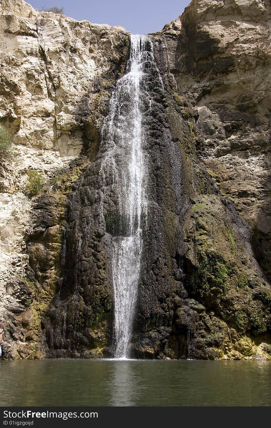 White waterfall over black rocks