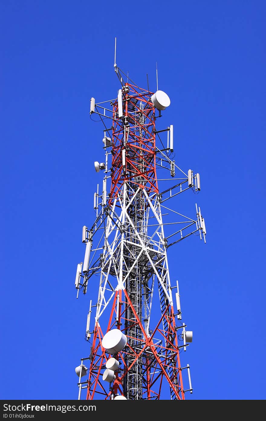 Communication tower under the crystal clear blue sky