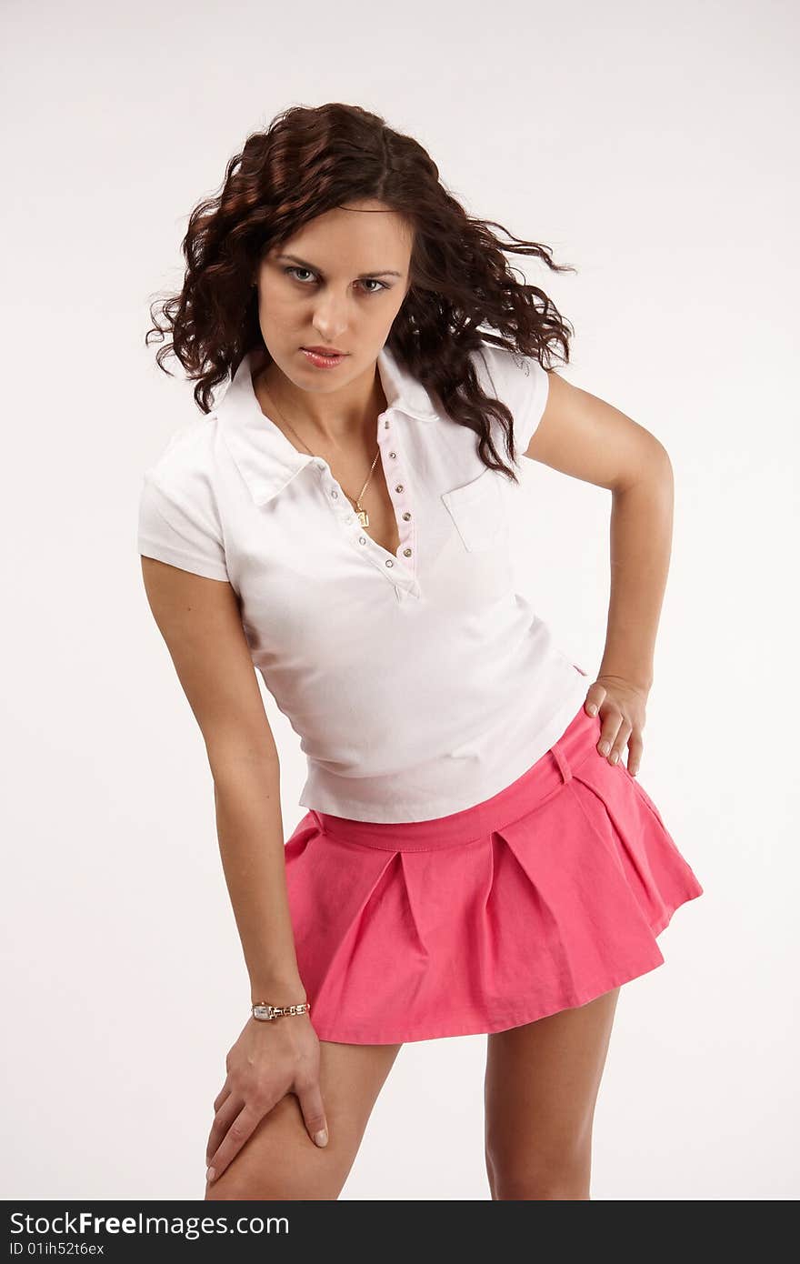 Young woman in white t-shirt and pink skirt