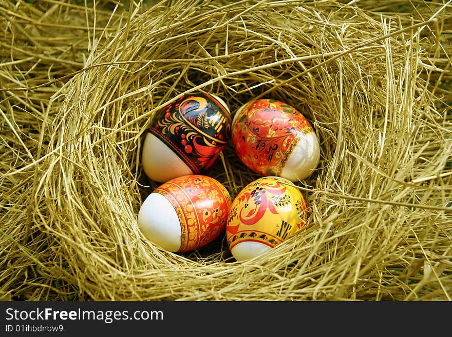 Four Easter eggs lie in a nest. Four Easter eggs lie in a nest