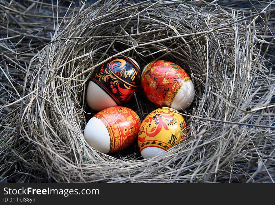 Four Easter eggs lie in a nest. Four Easter eggs lie in a nest