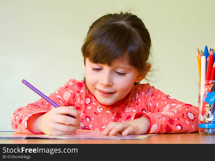 Cute 5 years old girl drawing