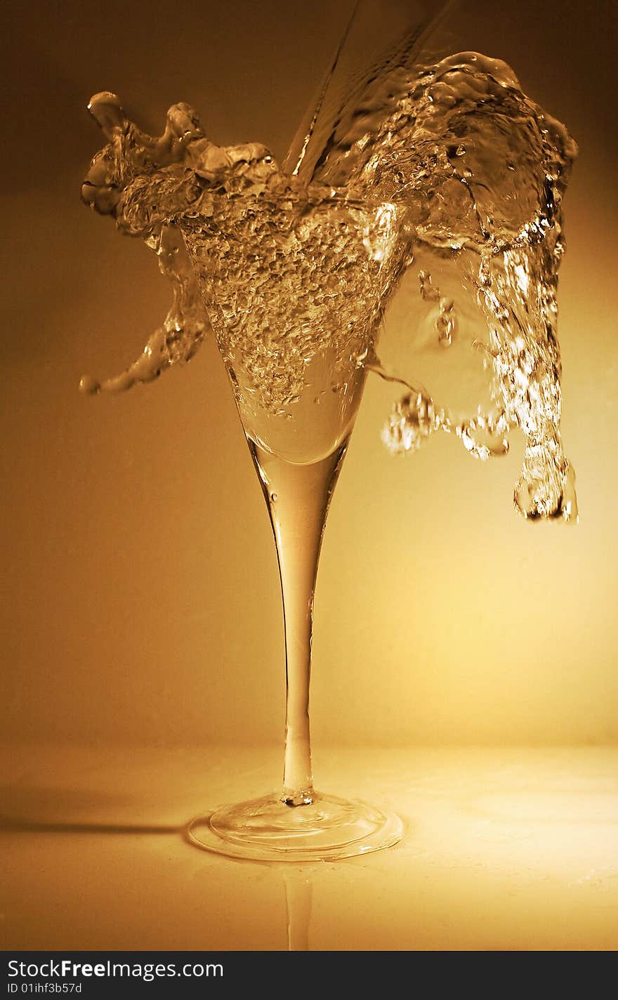 Pouring a glass of wine (or water, or champagne, or whatever you prefer) with a nice splash for dramatic effect.