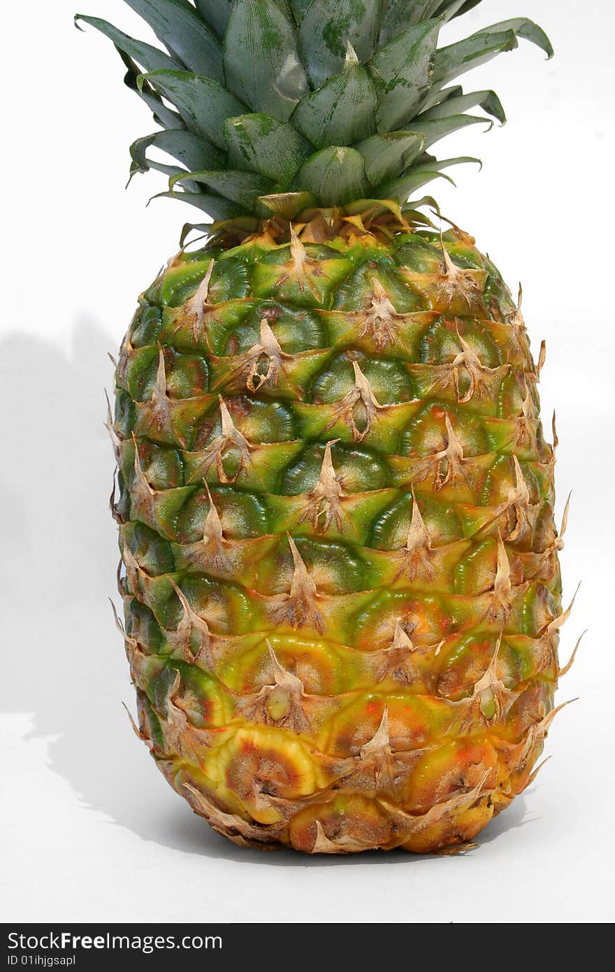 A ripe pineapple isolated on white