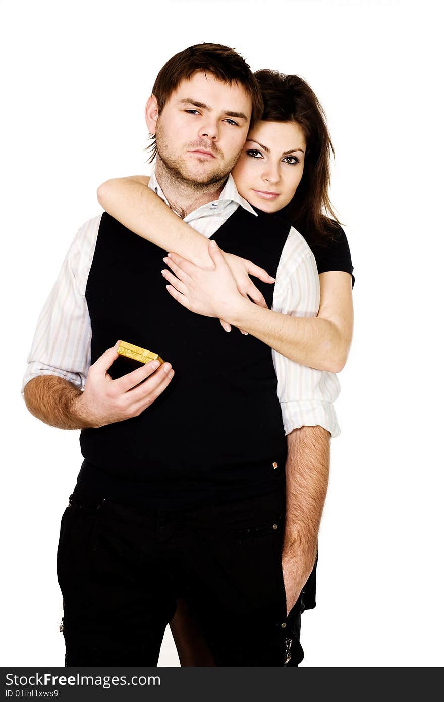 Stock photo: an image of a man with present and woman behind him. Stock photo: an image of a man with present and woman behind him