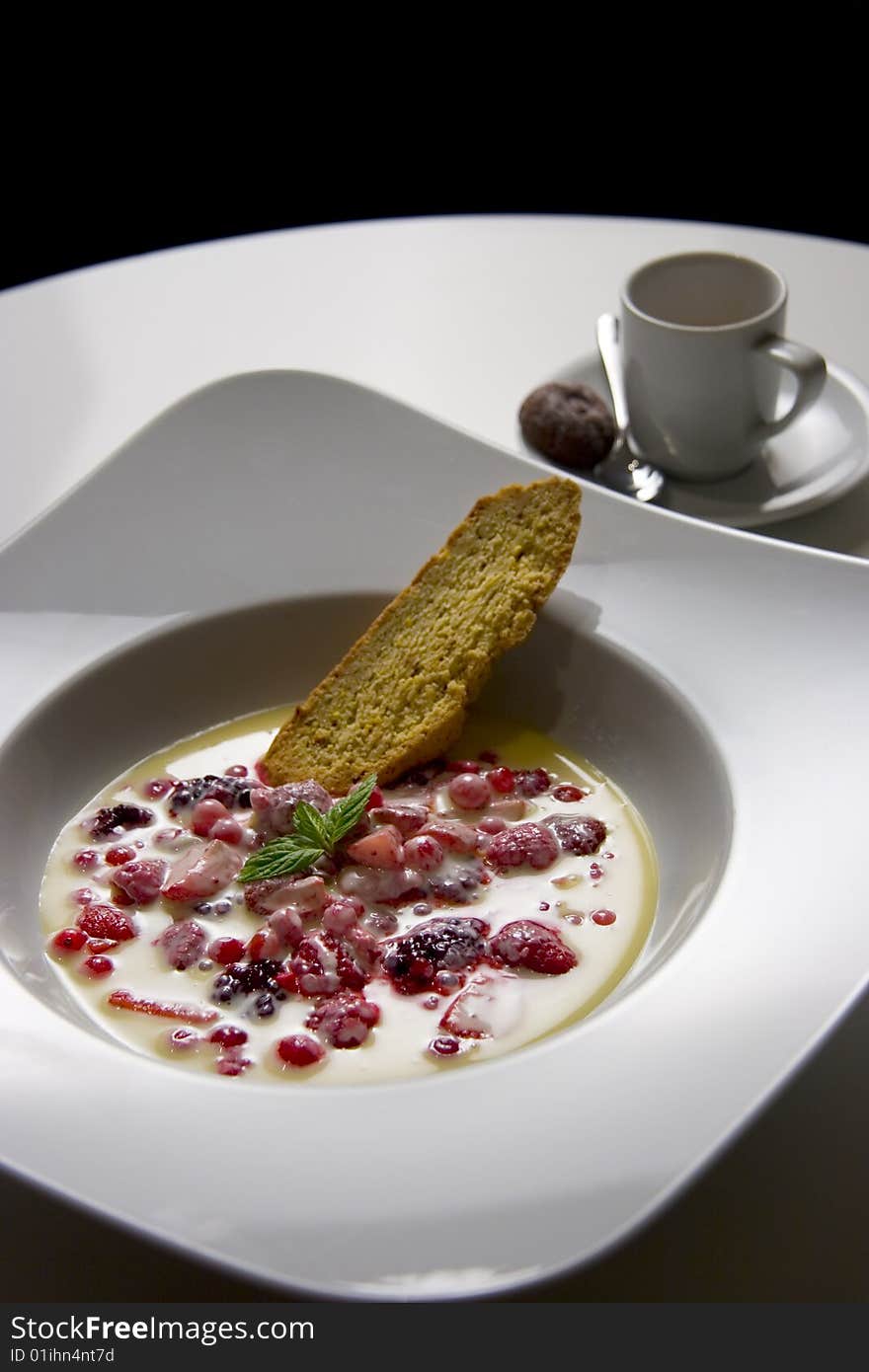 Fruit dessert with espresso, in white table serving. Fruit dessert with espresso, in white table serving