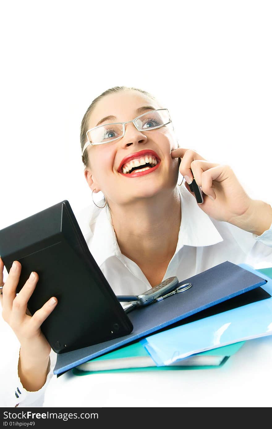 Happy young excited businesswoman talking on the phone