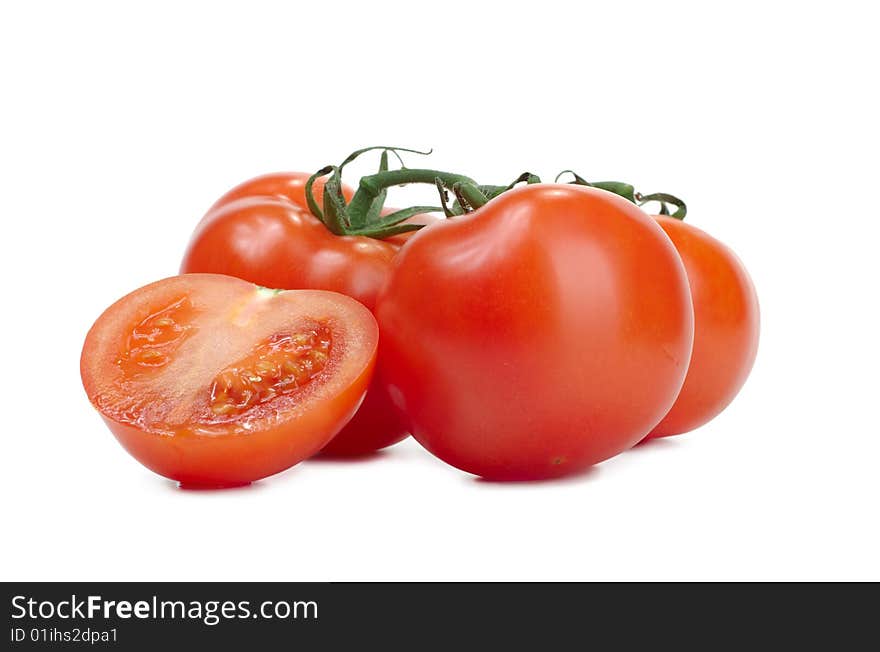 Some fresh red tomatoes on a white background