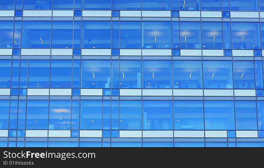 Corporate office building with anonymous people working