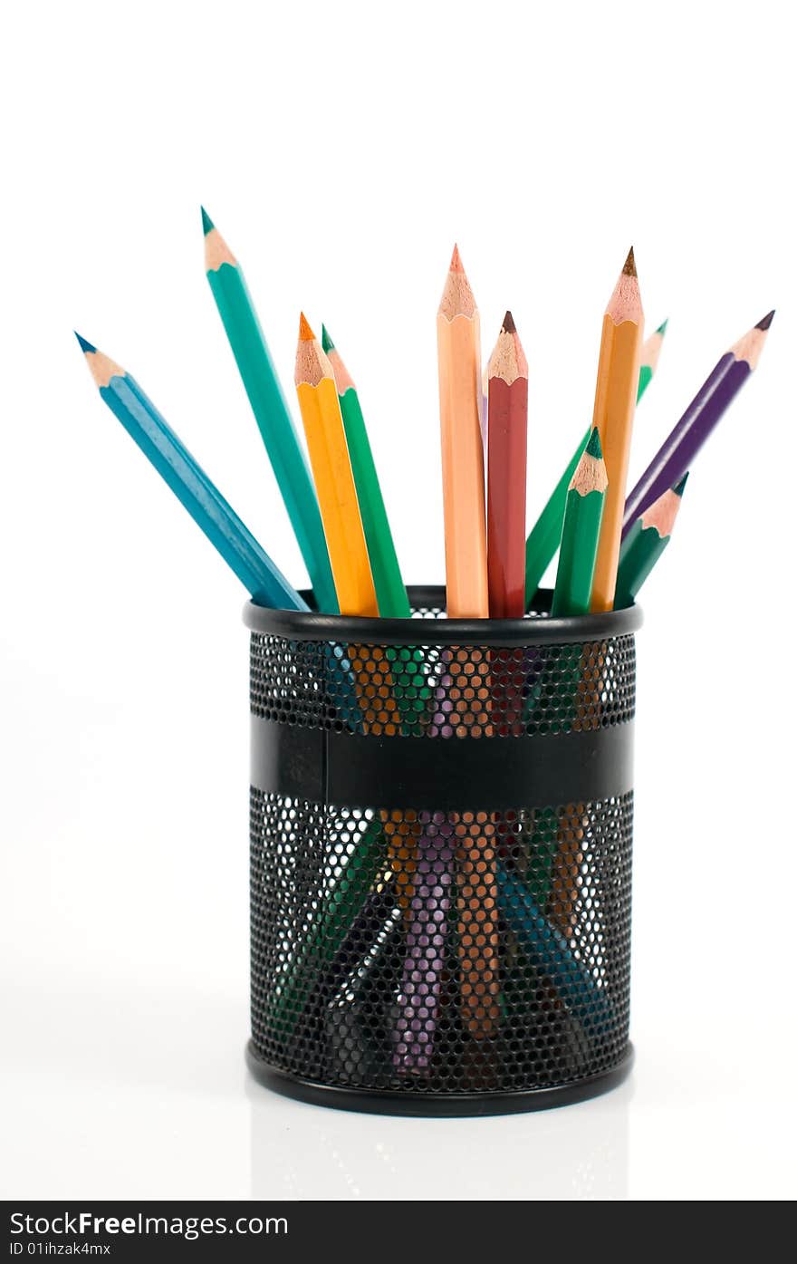 Colored pencils in pen holder on a white background