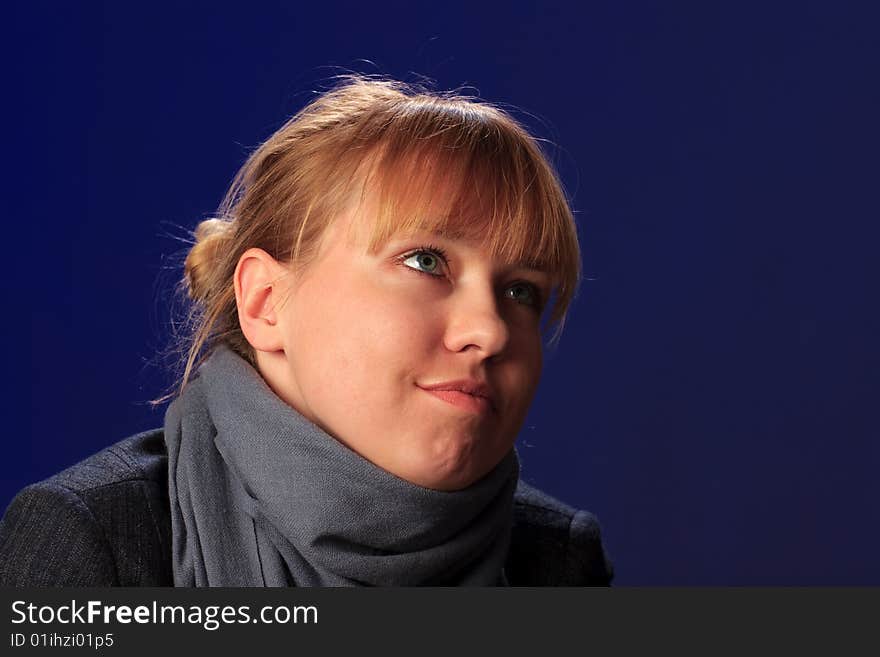 Portrait of female on a blue background in studio