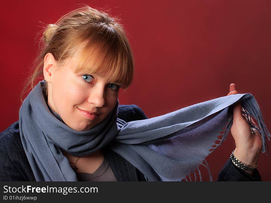 Portrait of female on a red background in studio