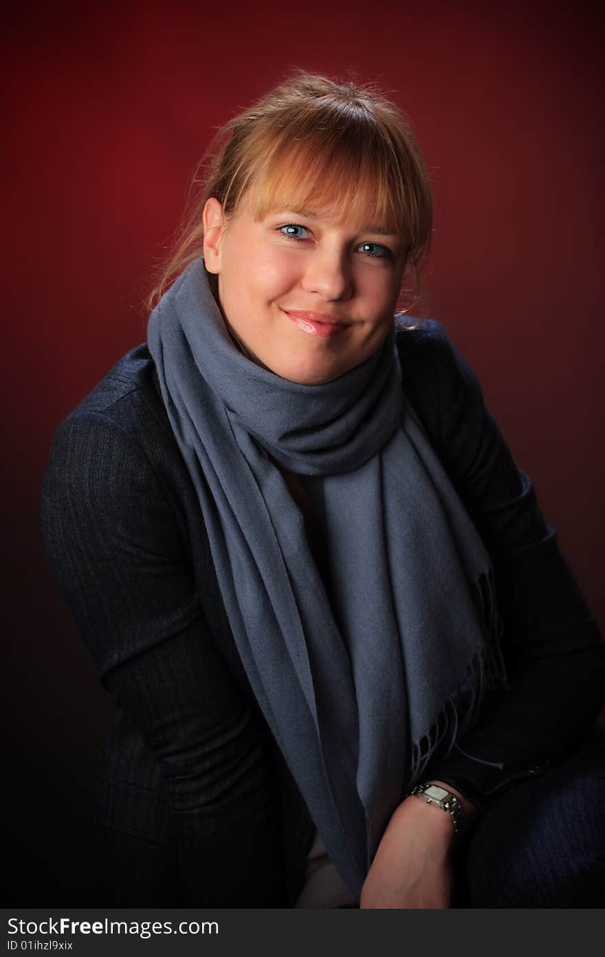 Portrait of female on a red background in studio