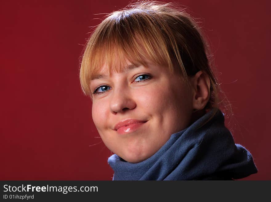 Portrait of female on a red background in studio