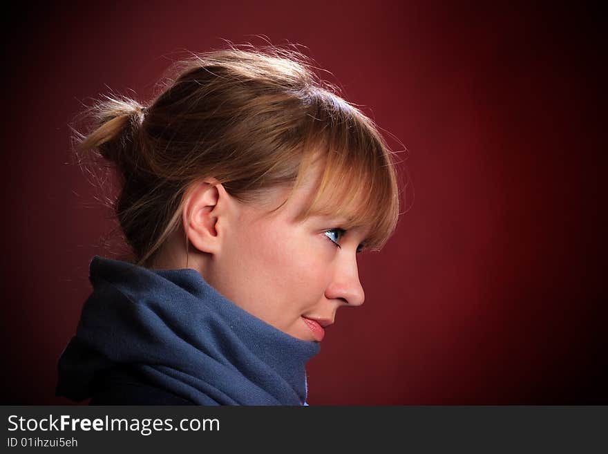 Portrait of female on a red background in studio