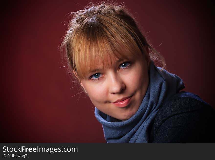 Portrait of female on a red background in studio