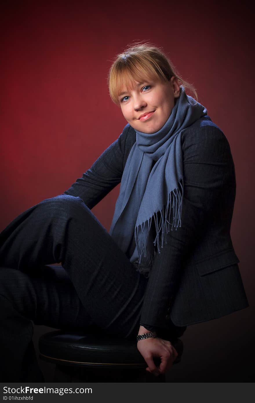 Portrait of female on a red background in studio