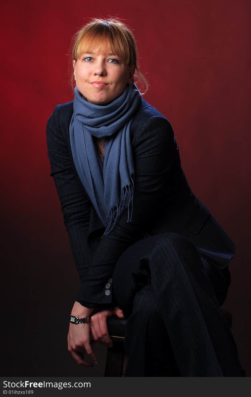 Portrait of female on a red background in studio