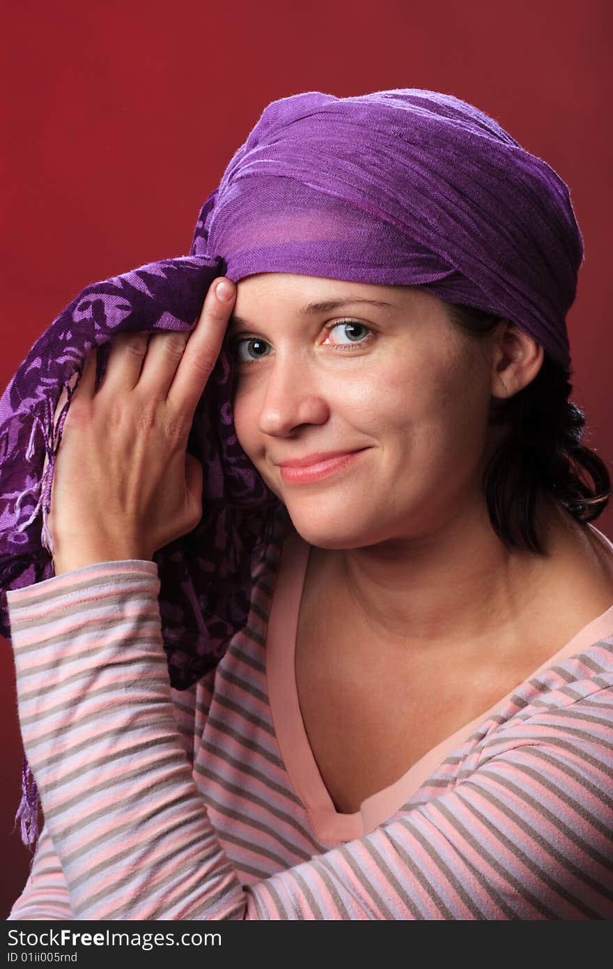 Portrait of female on a red background in studio