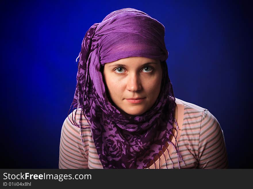 Portrait of female on a blue background in studio