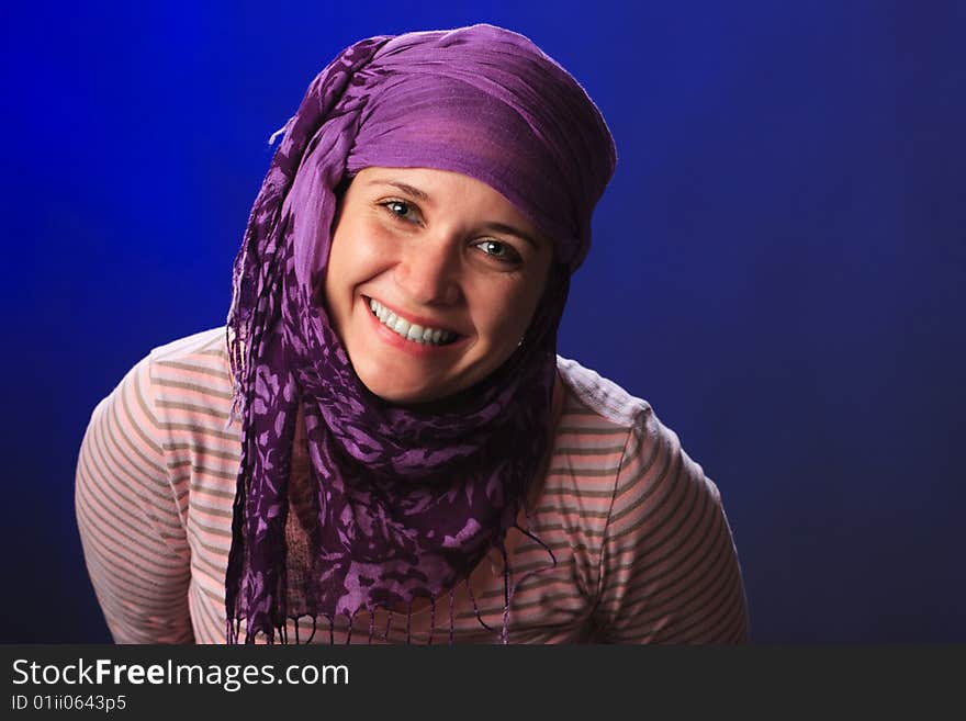 Portrait of female on a blue background in studio