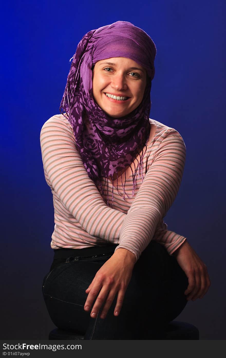 Portrait of female on a blue background in studio