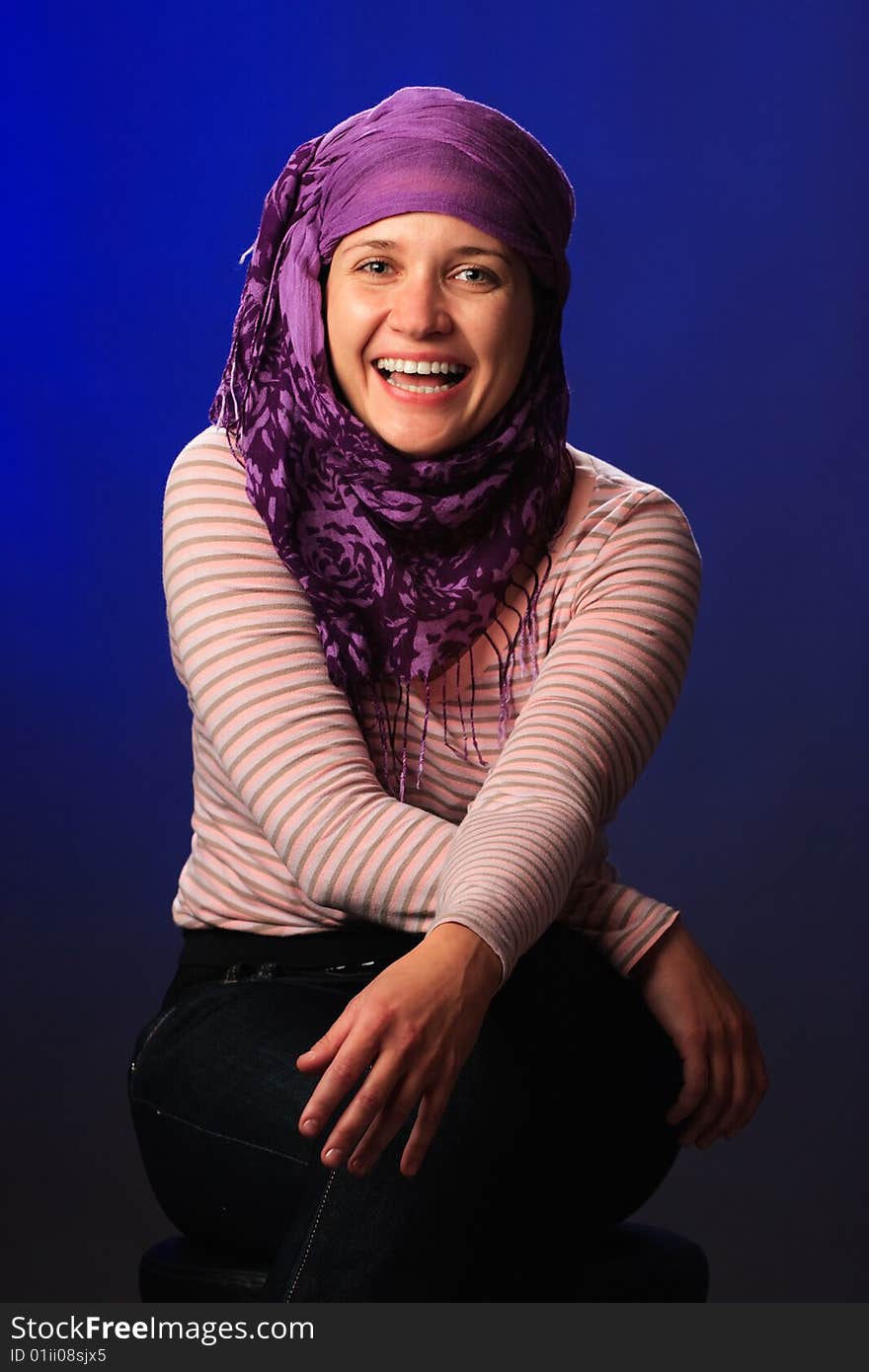 Portrait of female on a blue background in studio