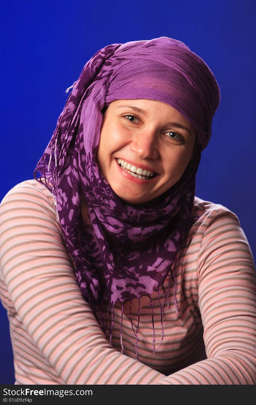 Portrait of female on a blue background in studio