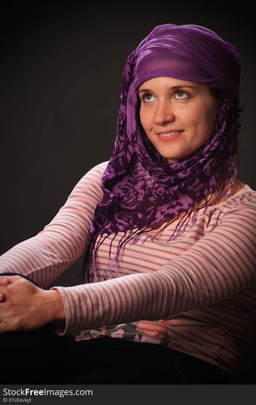 Portrait of female on a grey background in studio