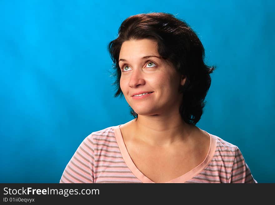 Portrait of female on a blue background in studio