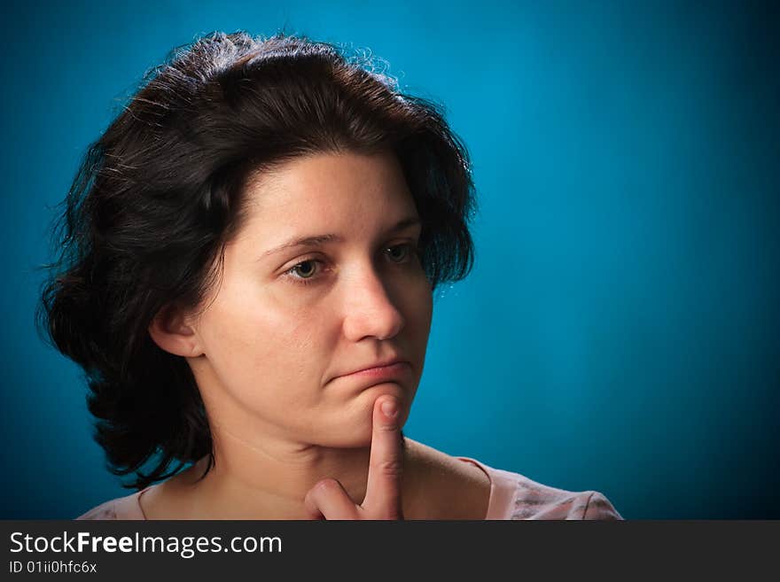 Portrait of female on a blue background in studio