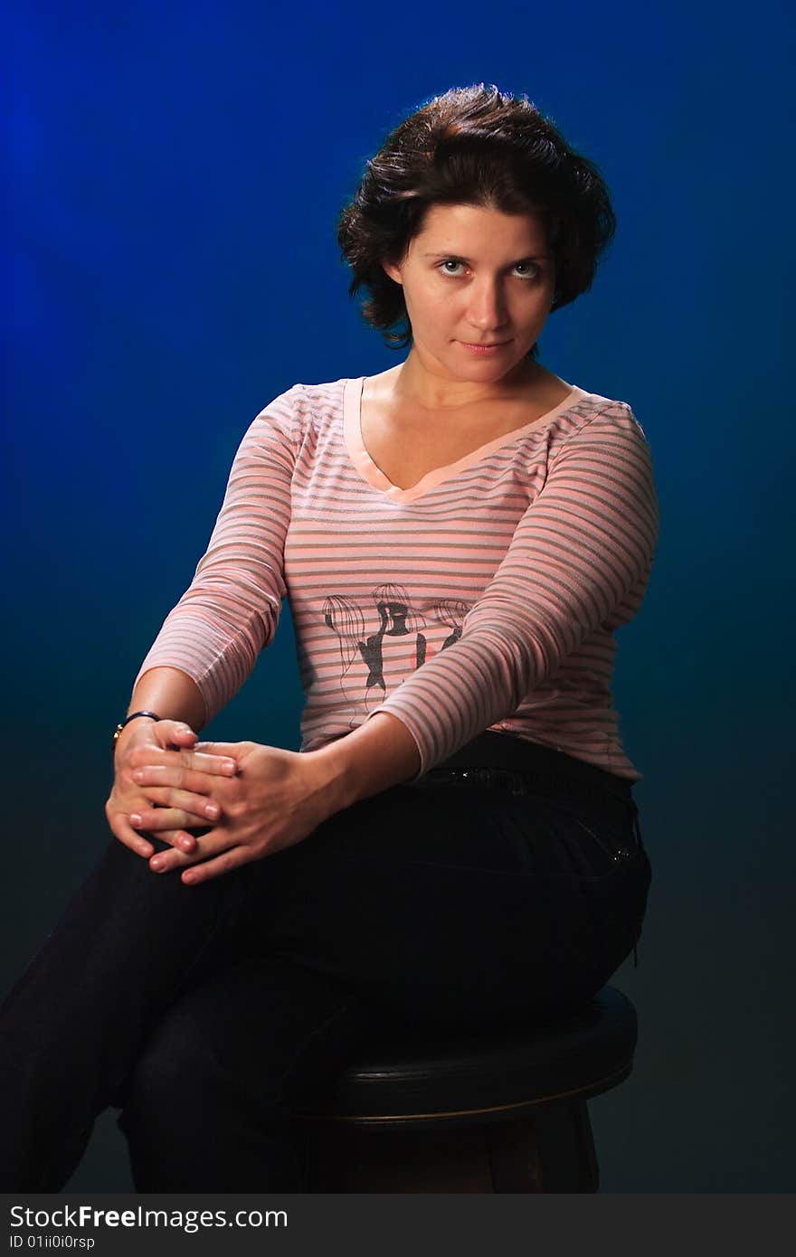 Portrait of female on a blue background in studio