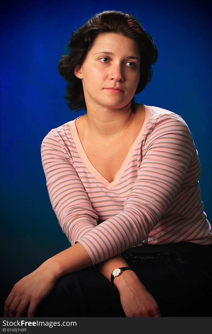 Portrait of female on a blue background in studio