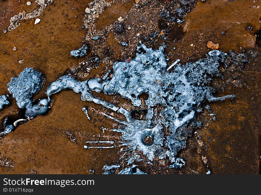 Metal drops on rusty floor