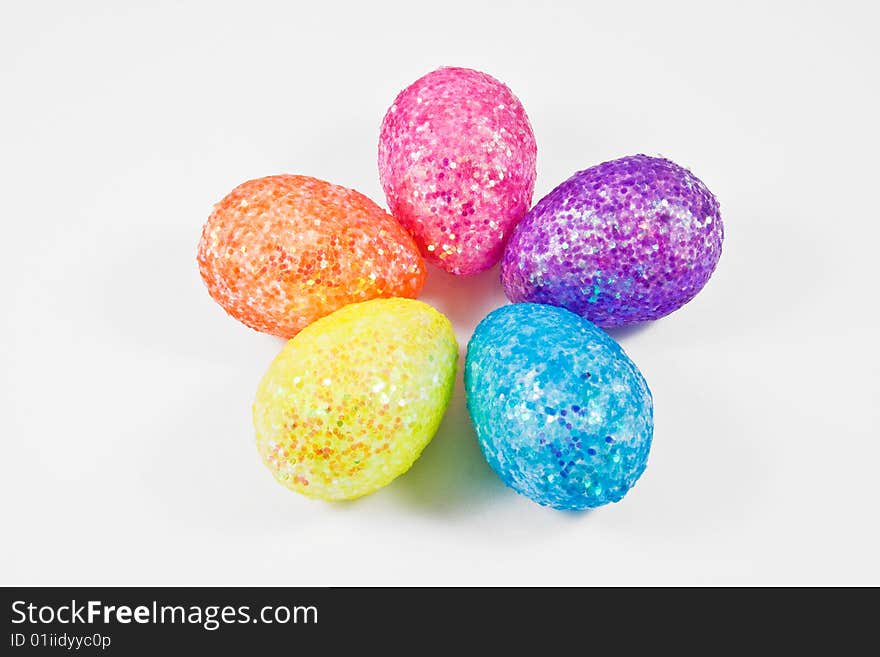 Five colorful eggs isolated on white arranged as flower petals. Five colorful eggs isolated on white arranged as flower petals