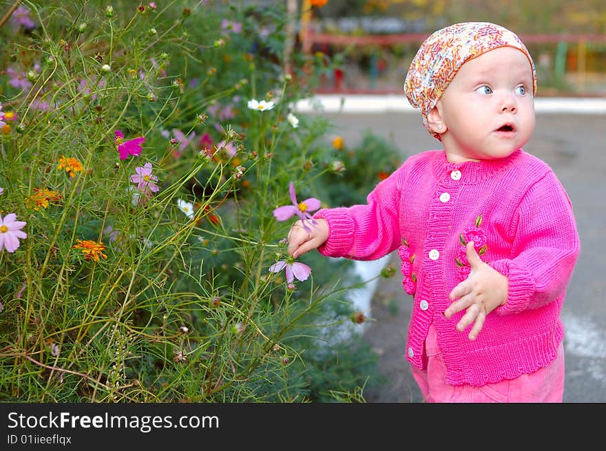 Pretty little girl with flowers.