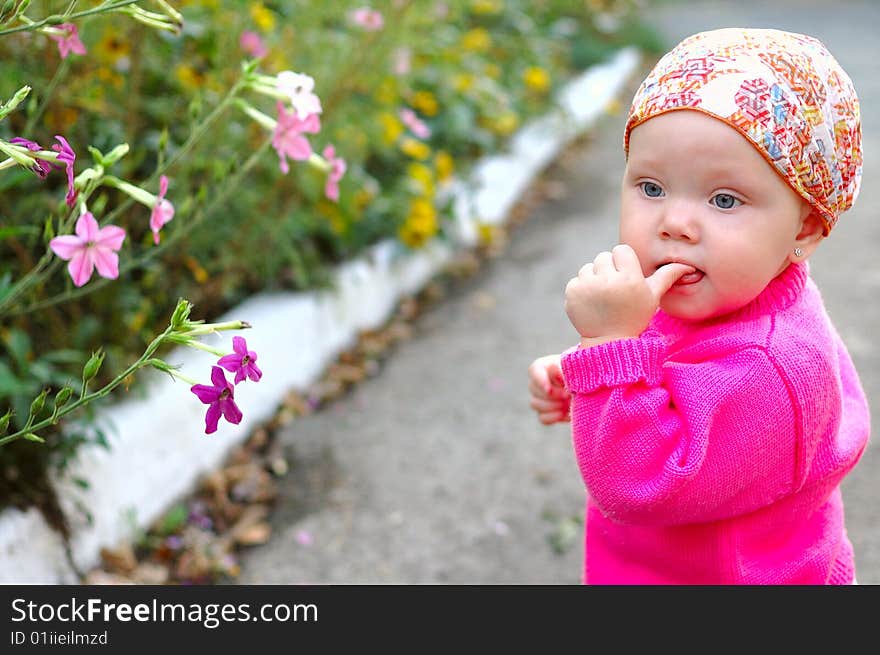 Pretty little girl with flowers - summer outdoor portrait. Pretty little girl with flowers - summer outdoor portrait.