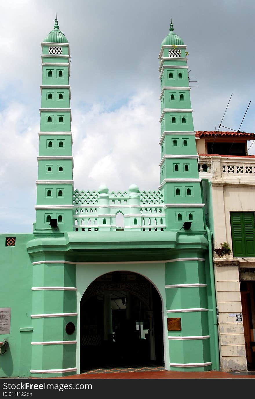 South Bridge Road facade of the 1826 Jamae Chulia Mosque in the Chinatown district of Singapore with its slender twin minarets - Lee Snider Photo. South Bridge Road facade of the 1826 Jamae Chulia Mosque in the Chinatown district of Singapore with its slender twin minarets - Lee Snider Photo.